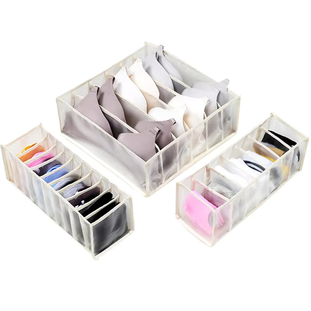 Clothes organiser with multiple compartments for neatly storing underwear, socks, bras, and scarves in drawers.