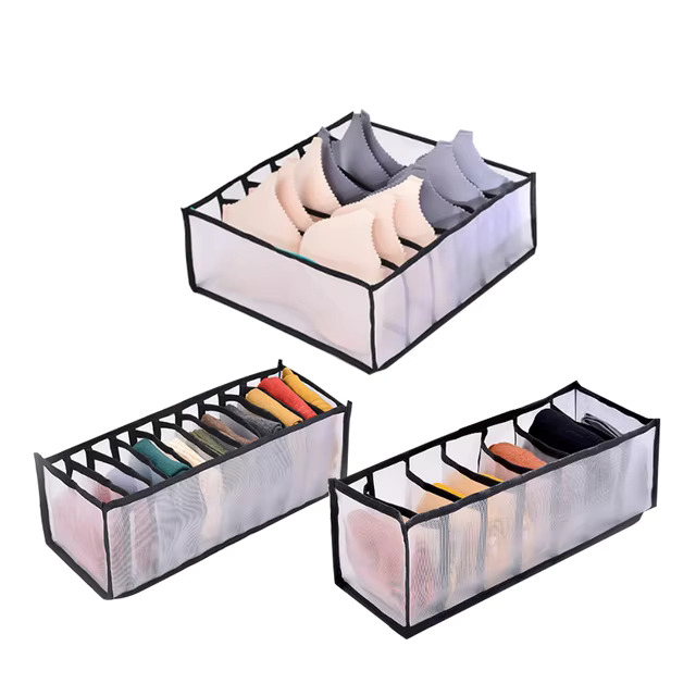 Clothes organiser with multiple compartments for neatly storing underwear, socks, bras, and scarves in drawers.