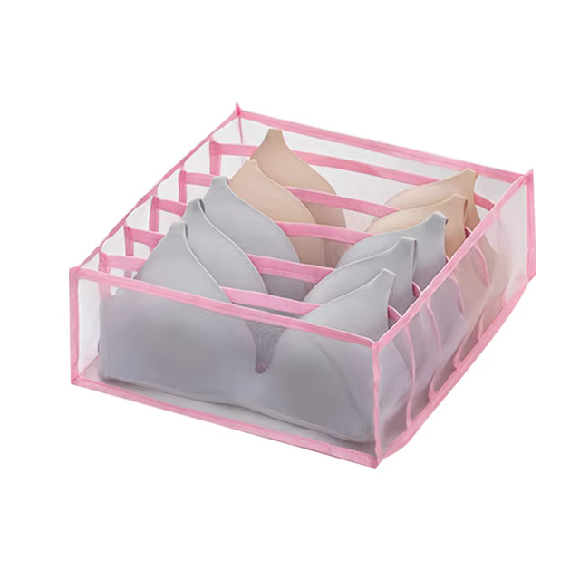Clothes organiser with multiple compartments for neatly storing underwear, socks, bras, and scarves in drawers.