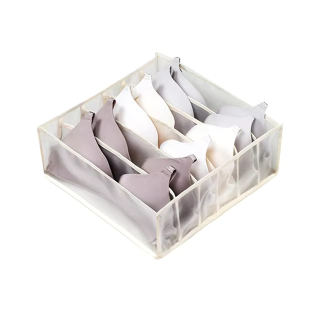 Clothes organiser with multiple compartments for neatly storing underwear, socks, bras, and scarves in drawers.